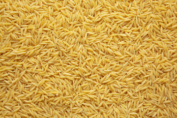 Raw Organic Risoni Pasta Background