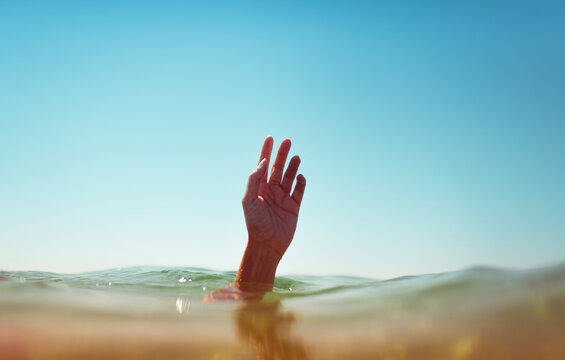 Hand Saying Hello From The Ocean