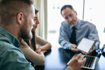 Man Asking About Financial Information On Tablet