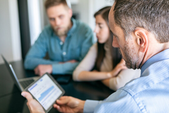 Financial Advisor Checks Investment Information