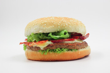 delicious burger with cheese, sausage and salad isolated on white background