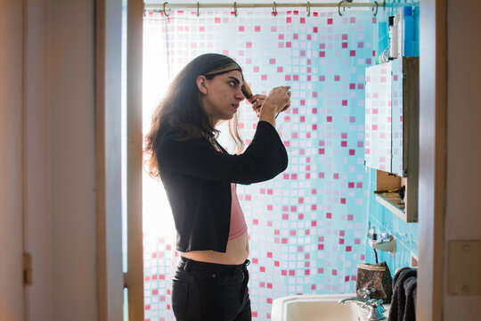 Trans teenage girl in the bathroom