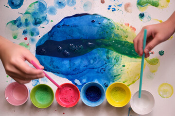 Closeup of the process of creating a watercolor painting