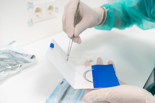 Dentist Hands Holding Tools