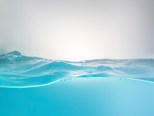 Blurred beautiful swaying water waves splashing water waves in clean blue water.