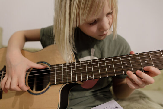 Child and musical instrument