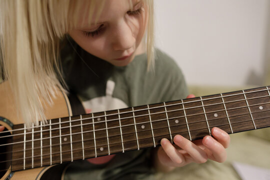 Fingers on guitar neck