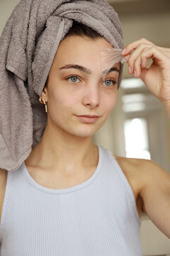 Young Woman With Peel-off Face Mask