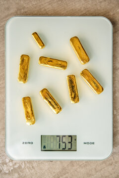 Gold Bars On Scales