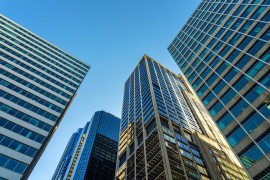 Modern office glasses buildings cityscape under blue clear sky in Washington DC, USA, outdoors financial skyscraper concept, symmetric and perspective architecture