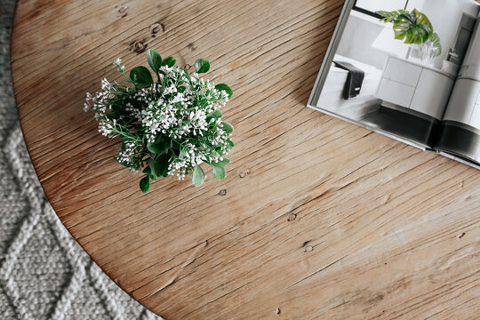 Round wooden Coffee table and plant from above