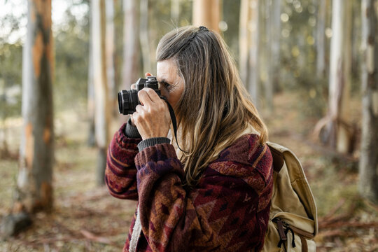 woman with camera in nature
