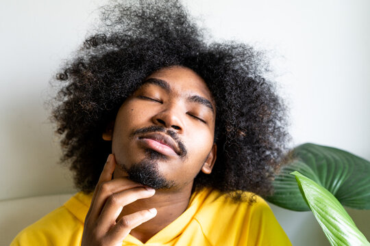 Young guy hangs out at home