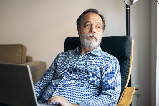 Relaxed middle-aged man at home