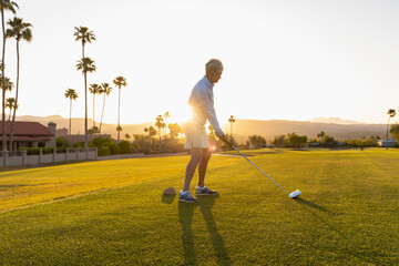 Backlit Senior Citizen Woman Playing Golf 
