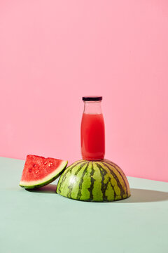 Bottle of healthy watermelon juice with slices