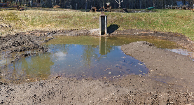 Earthworks at the construction site of a small village pond