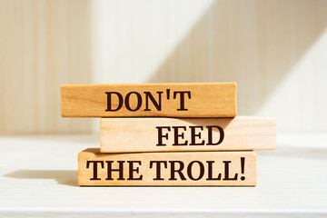 Wooden blocks with words 'Don't Feed The Troll'.