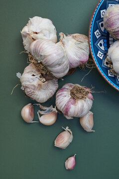 Garlic on green background