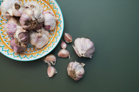 Purple garlic on green background