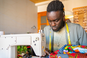 Black Tailor In A Fashion Design Studio.