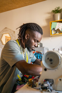 Tailor Working In A Fashion Design Studio.