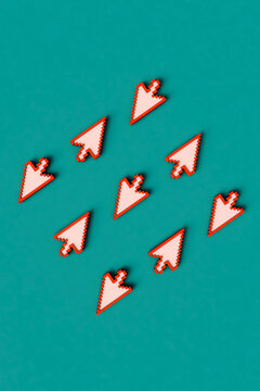 birds-eye view of pink arrow cursors