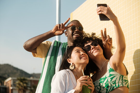 Happy friends having fun in summer