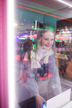Woman playing a game machine
