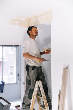 Interior designer fixing for painting wall