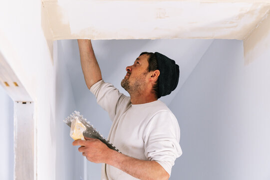 Interior designer fixing for painting wall