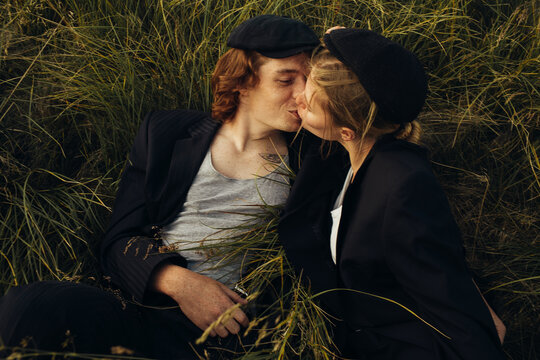 Couple kissing on green grass