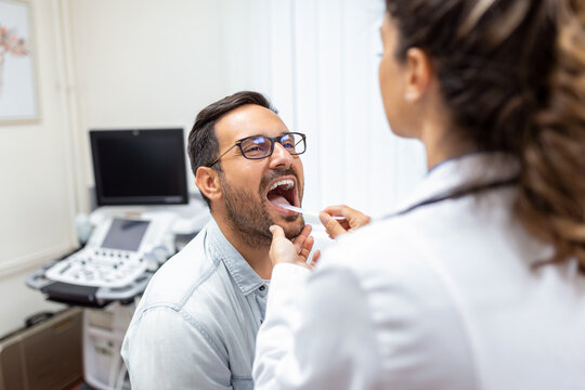Premium Vector  Ent doctor scientist examine inflamed throat
