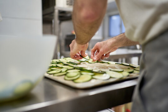 Female cook working in professional kitchen