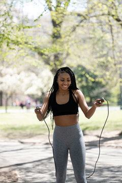 Young woman jumping rope