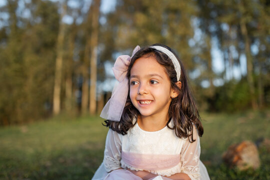 little girl in the field with a nice dress