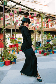 Woman dancing flamenco in a colorful street