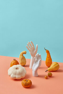 Helloween set from pumpkins and mannequin hands.