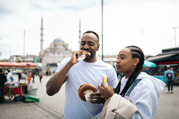 Friends sharing chocolate buns