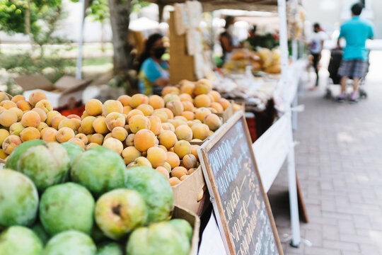 Fresh peaches for sale in an outdoor market