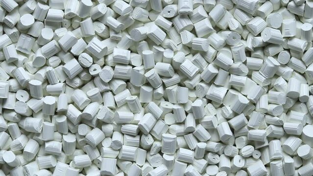 top view of white plastic resin ( Masterbatch ) rotation background