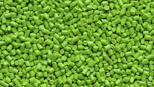 top view of green plastic resin ( Masterbatch ) rotation background