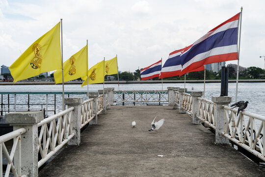 Thai flags flying on a pier in Bangkok