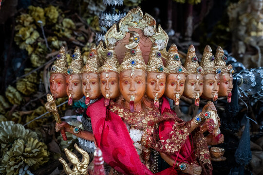 Figurine with many faces in a spirit house