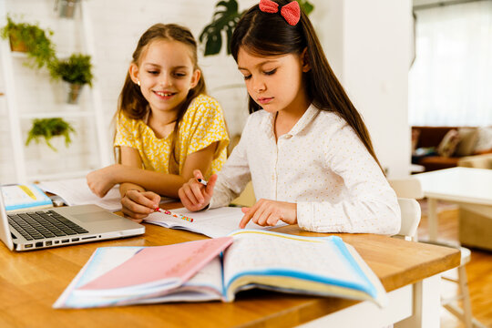 Little girls having homeschooling 