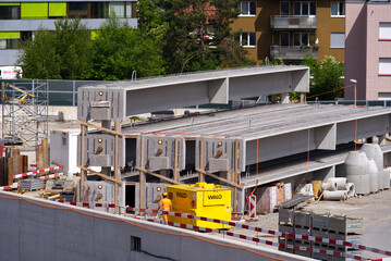 Stapled concrete girders at highway enclosure construction site at City of Zürich on a sunny spring day. Photo taken May 16th, 2022, Zurich, Switzerland.