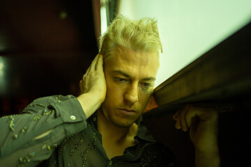 Portrait Of A LGBTQ Man With Mental Anxiety At Night.