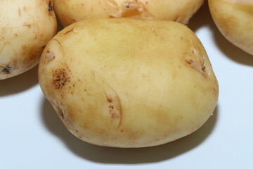 The first summer potato. New potatoes isolated on a white background. Healthy eating
