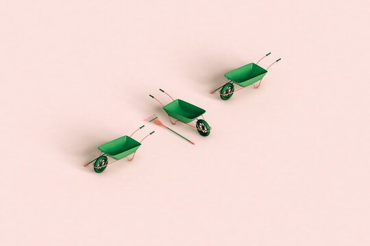 green rake and wheelbarrow on a pink background