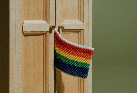 rainbow flag peeking out of a closet